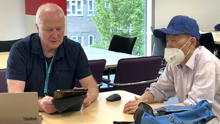paul working with a participant at the bring your own tech day