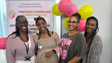 four members of precious counselling and mentoring smiling