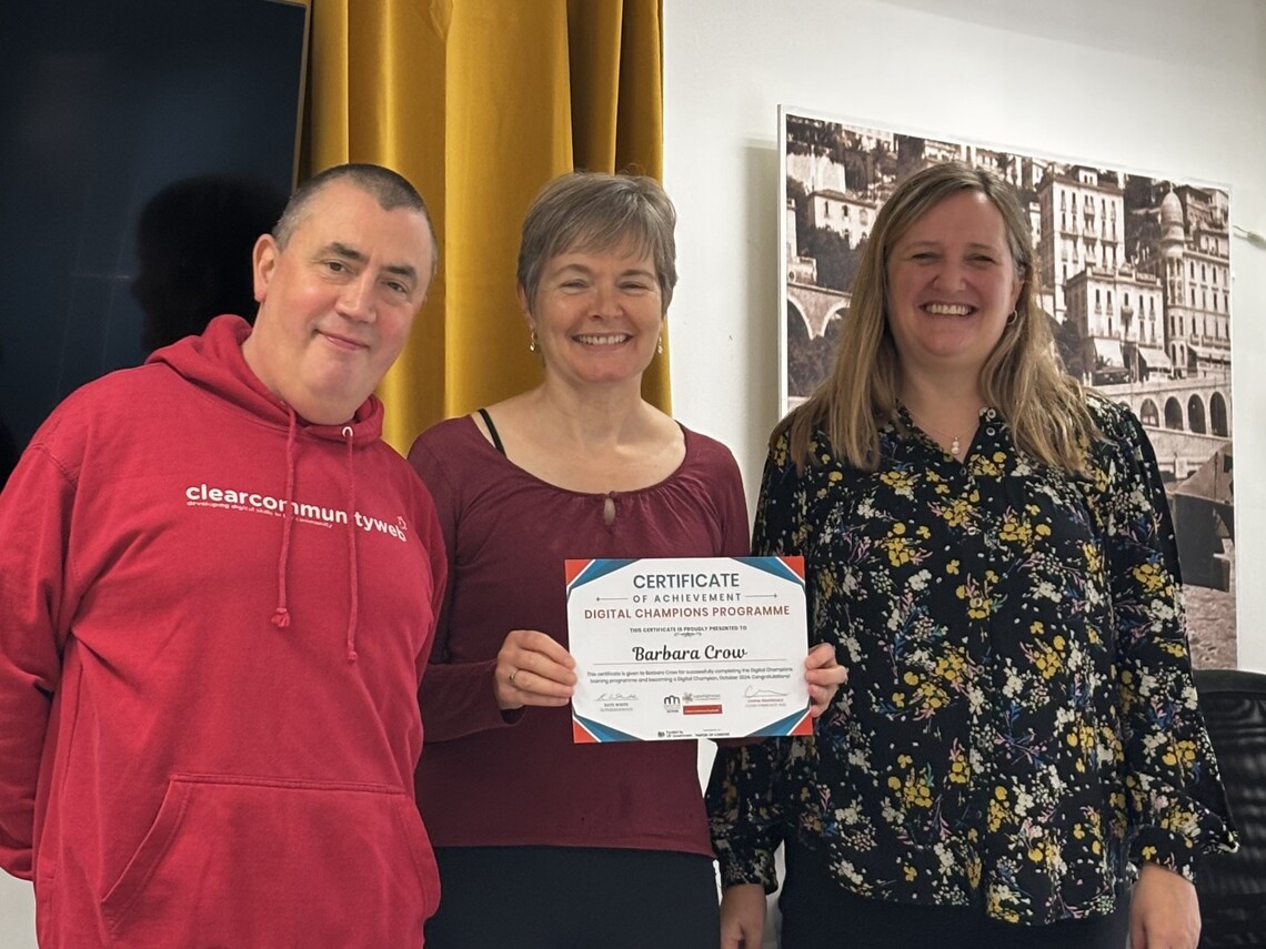 barabara holding certificate of achievement award