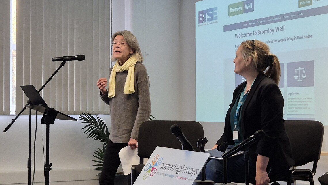 sue from Bromley Well discussing superhighways' support with website at conference