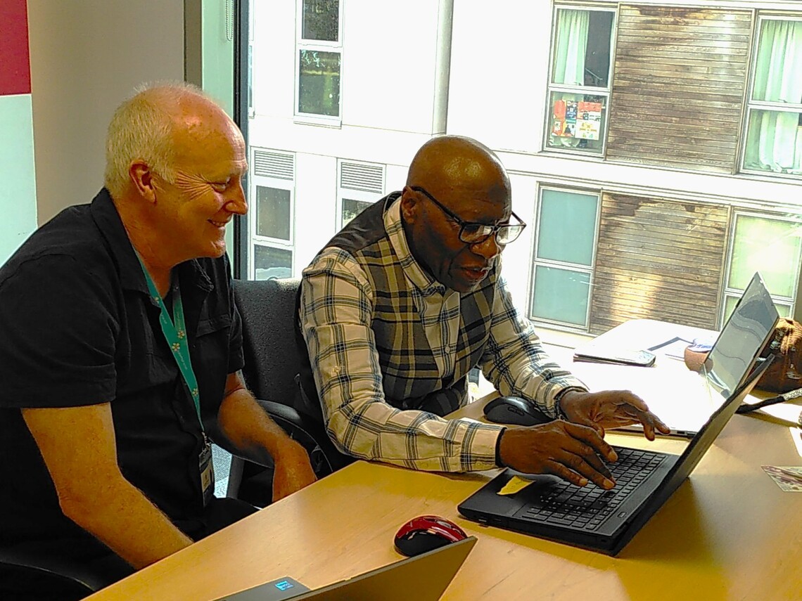 paul working with a participant at the bring your own tech day
