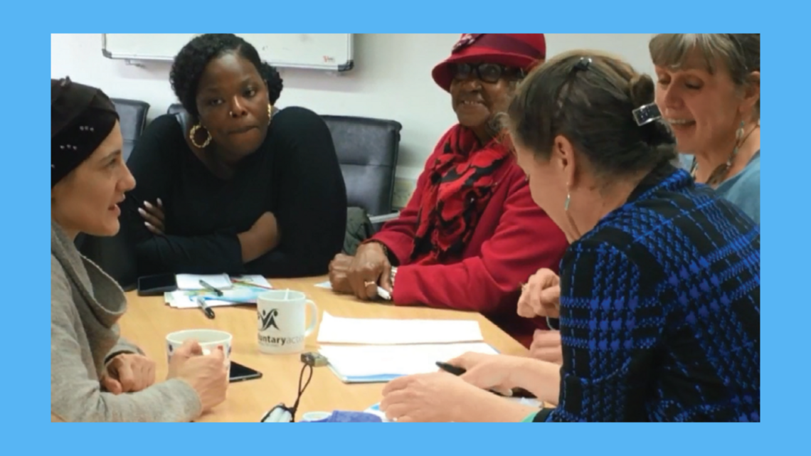 Photo of people in discussion at workshop