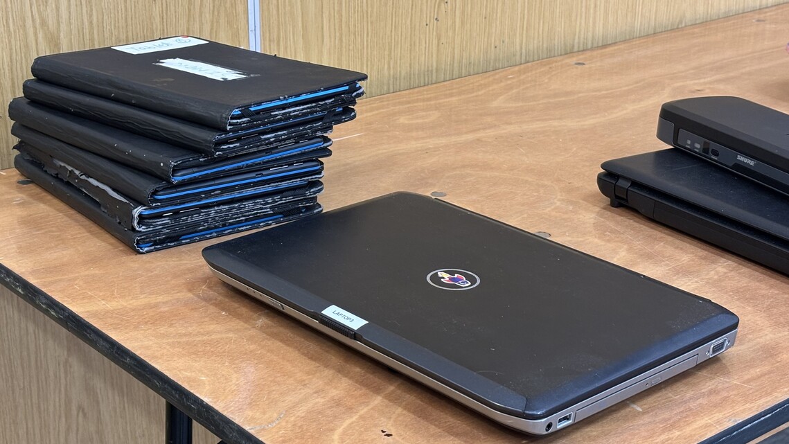 stack of tablets and laptops